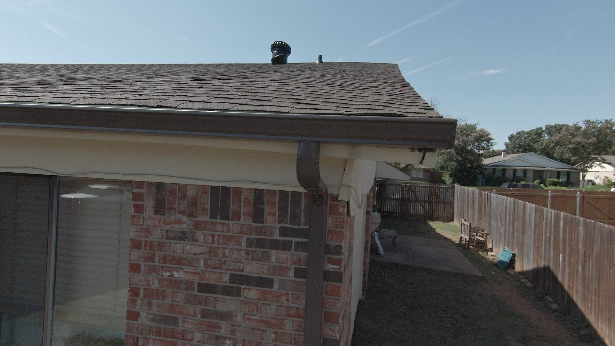 Finished roof edge and gutter on a brick home, Garland, TX