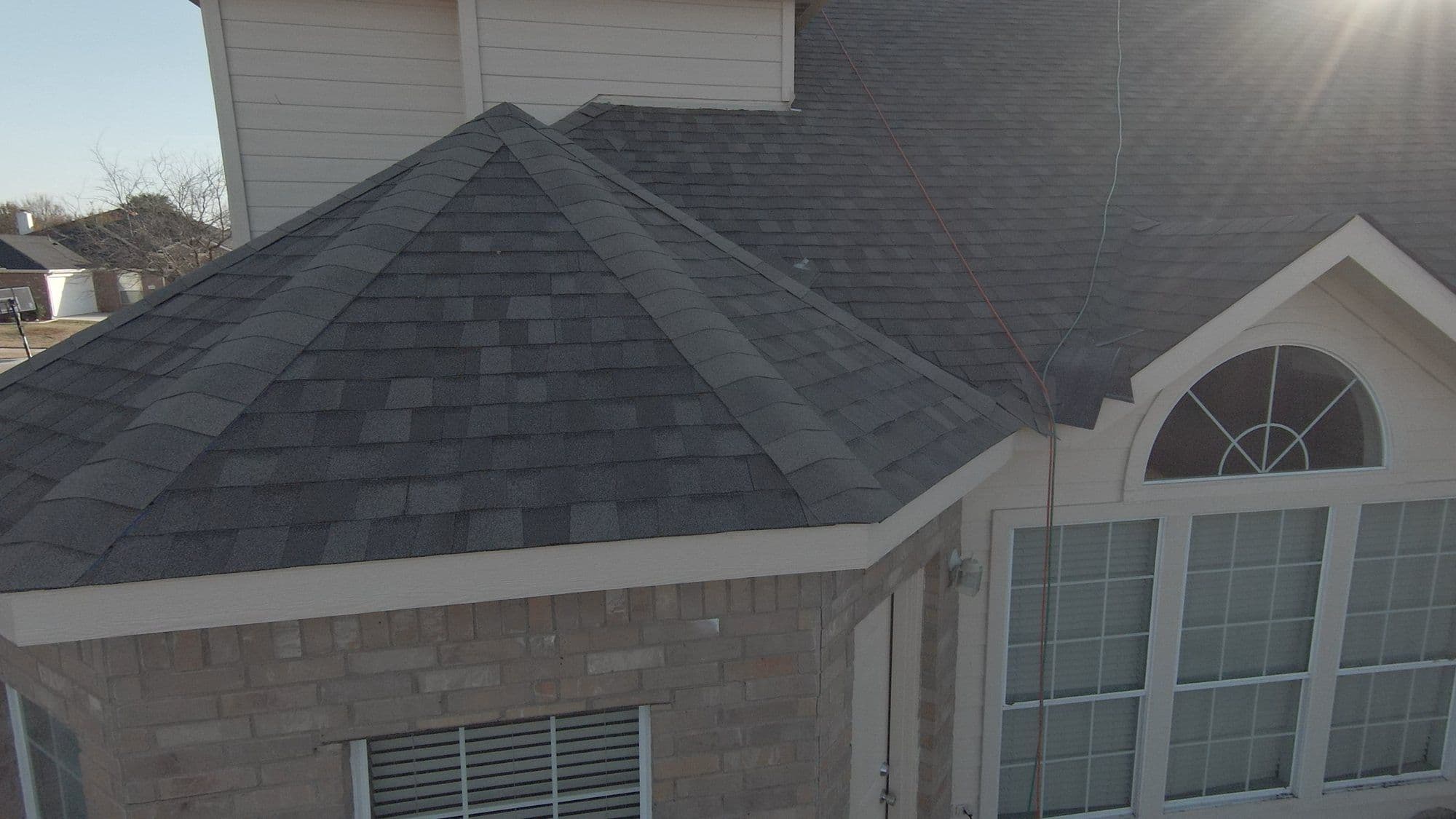 Finished hip roof over an arched window, Forney, TX